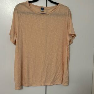 Loose fitting T-shirt.